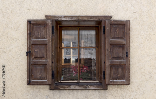 Old wooden window with shutters