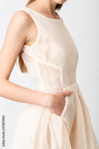Young girl in a beige dress