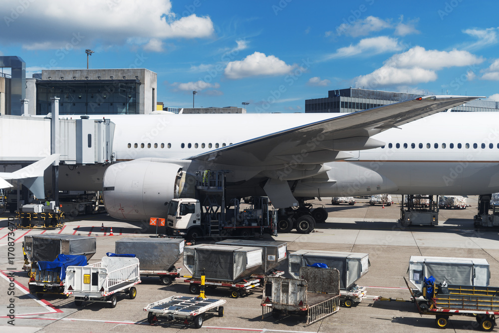 Passenger plane in the airport. Aircraft maintenance. Passenger plane in the airport. Aircraft maintenance.