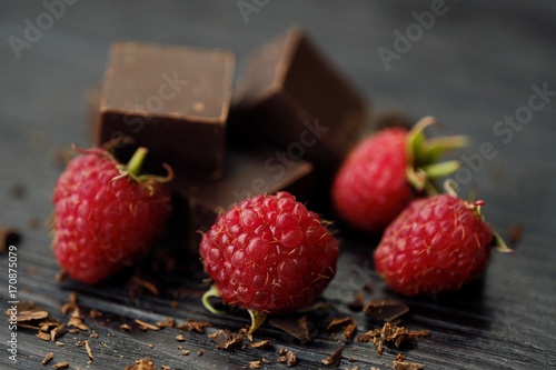 Delicious dark chocolate and ripe pink raspberries 