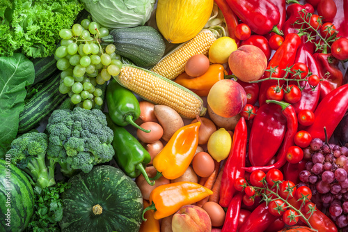 Fruits and vegetables overhead assortment colorful background green, yellow to red