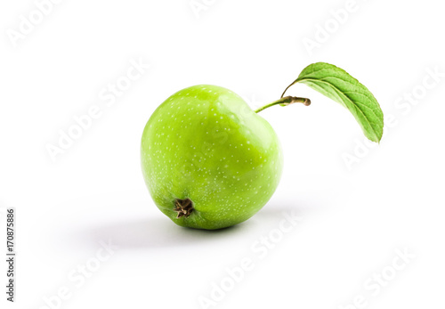 Organic green apple with leaf isolated closeup on white background in studio