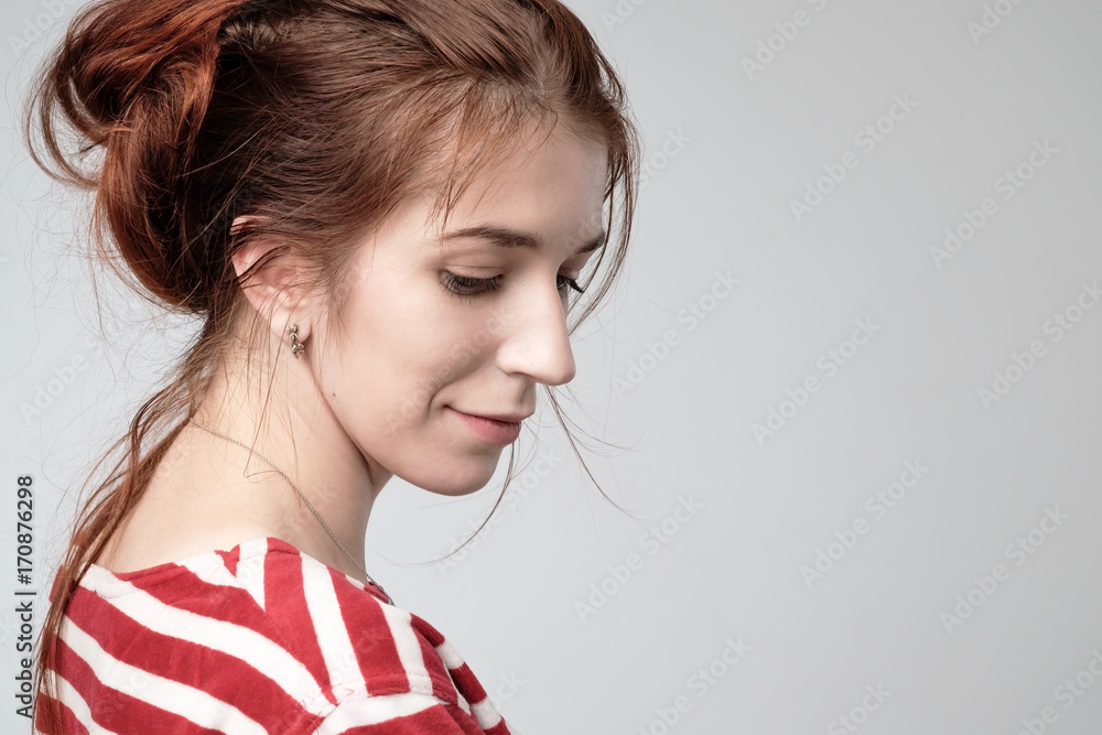 beautiful teenager girl with red hair side view. beautiful teenager girl with red hair side view.