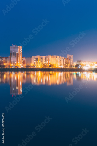Night View Of Urban Residential Area Overlooks To City Lake Or River