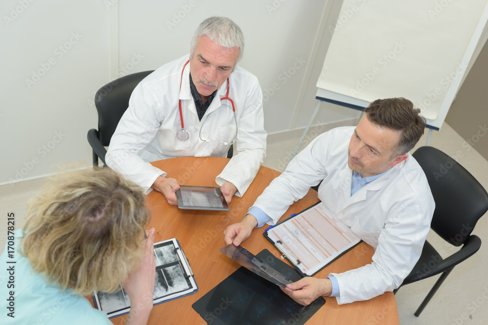 group of doctors meeting at medical office group of doctors meeting at medical office