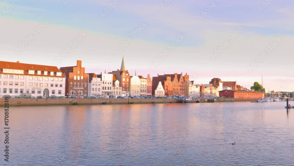 Sunrise view of the Old Town pier architecture in Lubeck, Germany Sunrise view of the Old Town pier architecture in Lubeck, Germany