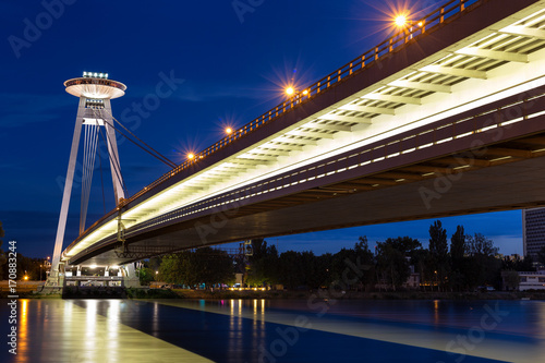 Night view of the illuminated SNP bridge over Danube in Bratislava, UFO, Slovakia photo