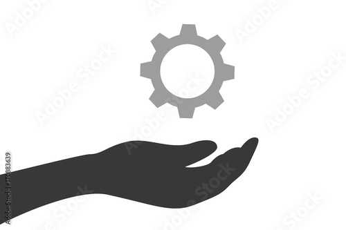 Hand hält Zahnrad