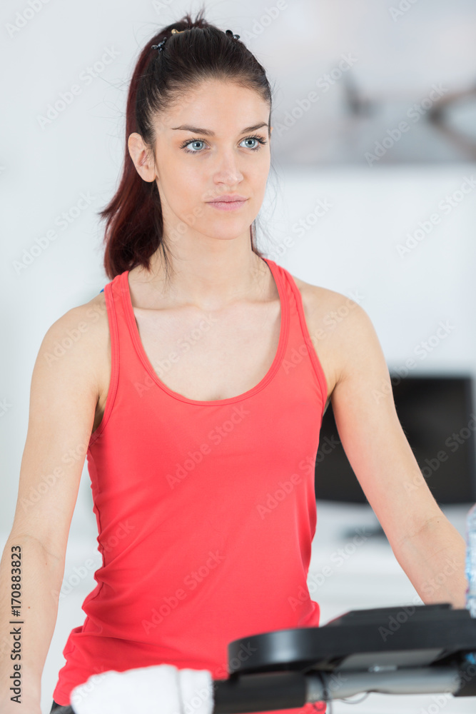teenager girl exercising on stepper trainer