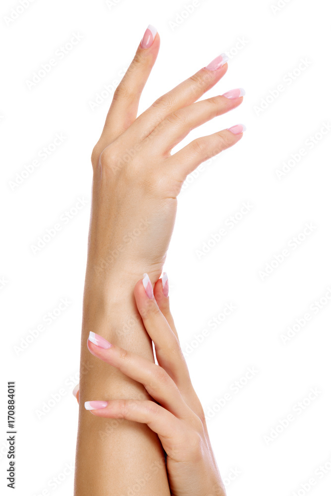 Closeup shot of woman's hands with french manicure and clean and soft skin over a white background, isolated Closeup shot of woman's hands with french manicure and clean and soft skin over a white background, isolated