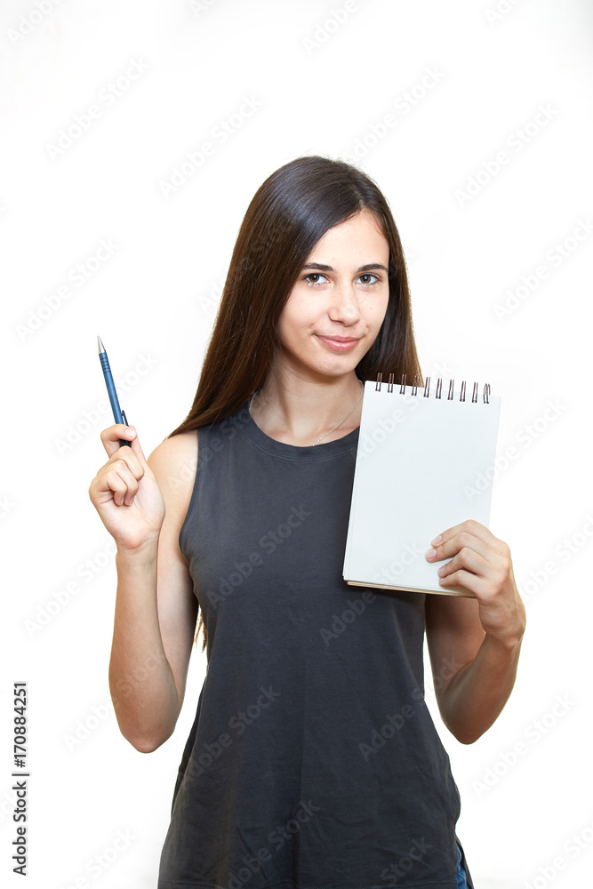 Portrait of happy smiling young woman isolated over white background. Holds a notepad and pencil Portrait of happy smiling young woman isolated over white background. Holds a notepad and pencil
