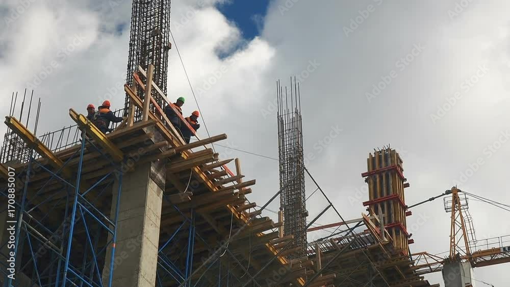 Building construction. Builders are building an apartment house ...