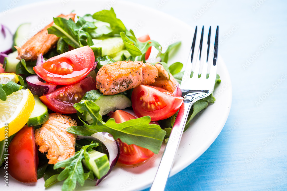 Fresh salad with salmon and vegetables. Fresh salad with salmon and vegetables.