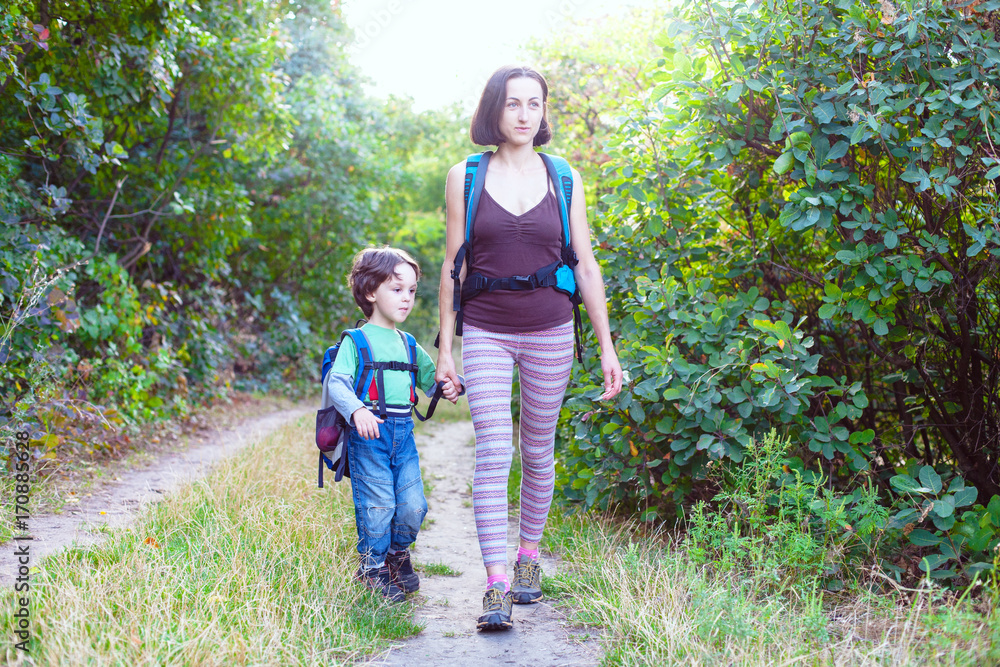 Boy and mom in the forest. Boy and mom in the forest.