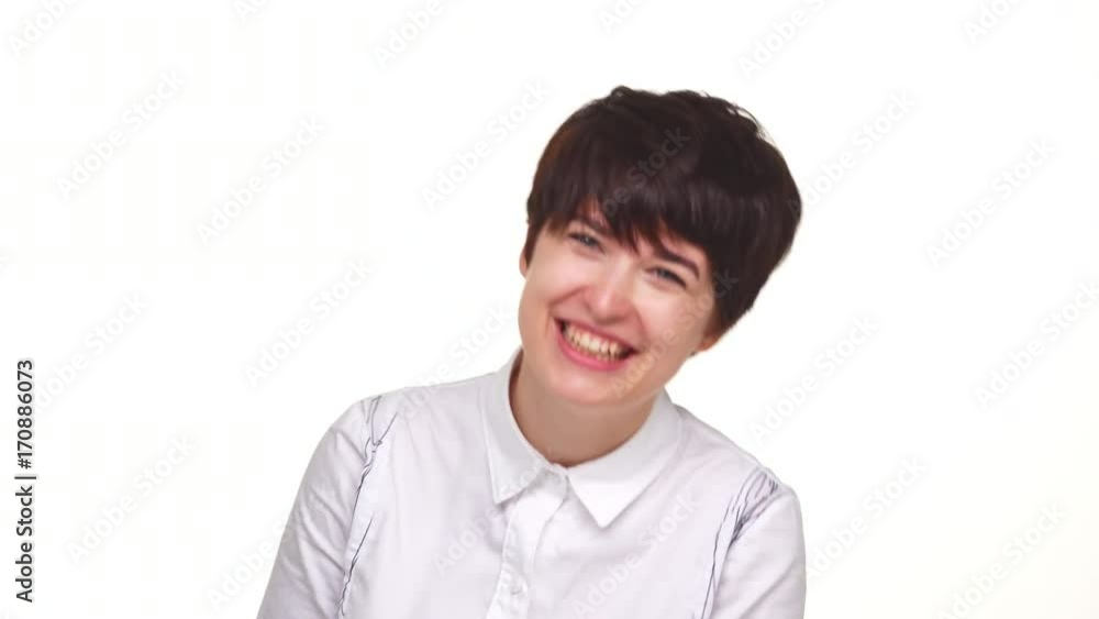 Cute lady with short haircut winking eyes isolated over white background. Concept of emotions Cute lady with short haircut winking eyes isolated over white background. Concept of emotions