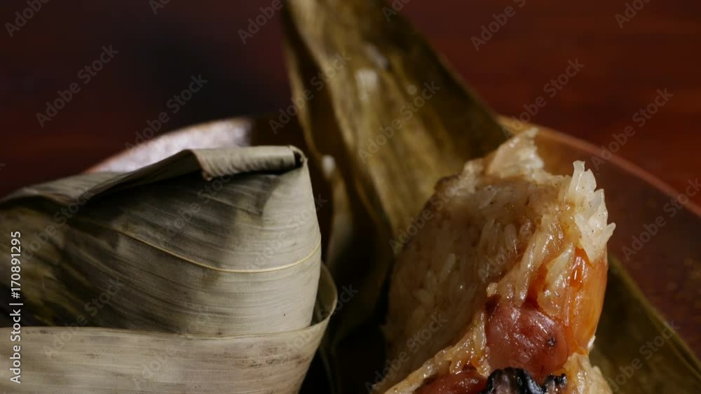 'Zongzi' or 'bakcang', 'bacang' a Chinese traditional food made of glutinous rice with different fillings and wrapped in bamboo or large leaves. 'Zongzi' or 'bakcang', 'bacang' a Chinese traditional food made of glutinous rice with different fillings and wrapped in bamboo or large leaves.
