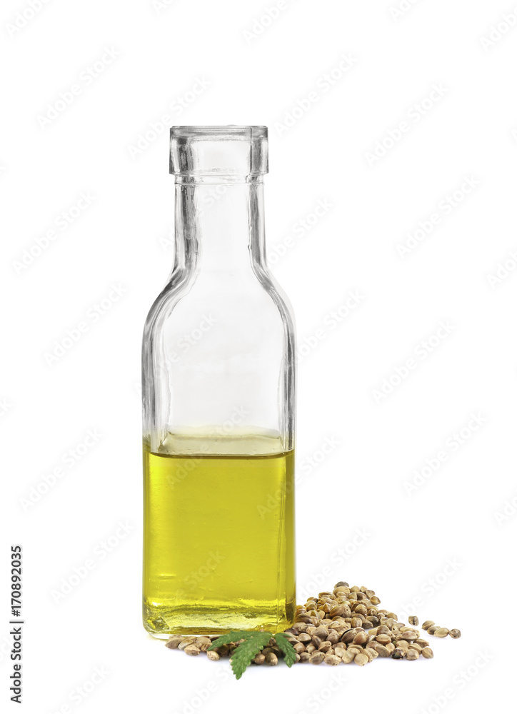 Glass bottle with hemp oil isolated on white Glass bottle with hemp oil isolated on white