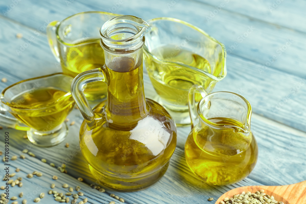 Composition with hemp oil on wooden background Composition with hemp oil on wooden background