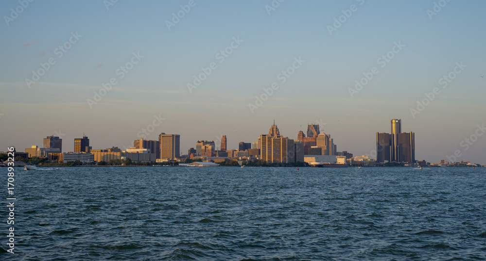 Fototapeta premium View of downtown Detroit skyline and river at sunset a