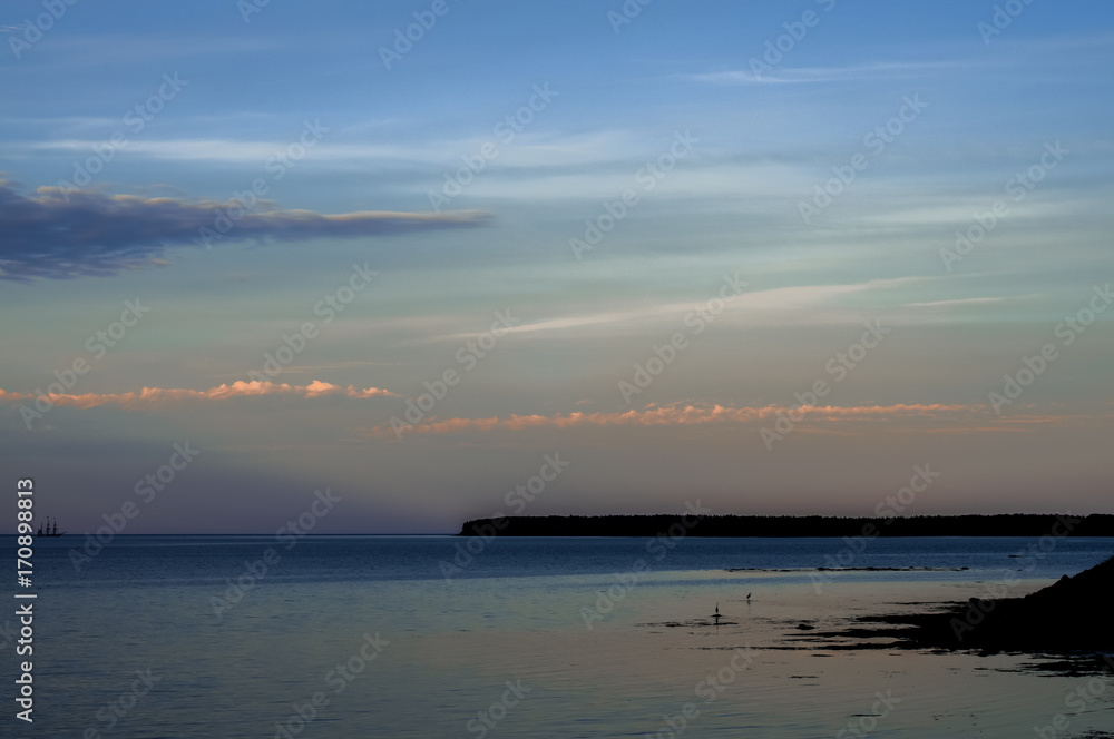 Tall ship sailing at sunset in the ocean Tall ship sailing at sunset in the ocean