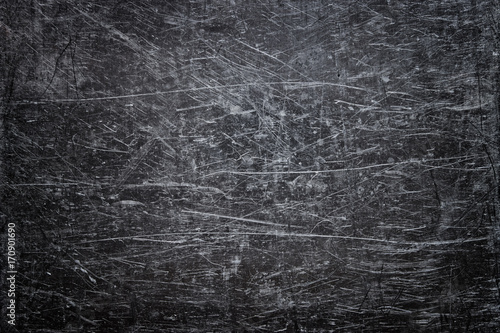 Damaged steel texture, dark metal background with scratches on the surface