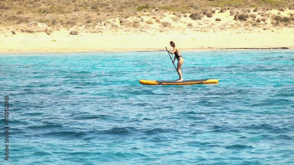 Woman on sup board paddle in sea, super slow motion 240fps
Woman on sup board paddle in sea, super slow motion 240fps