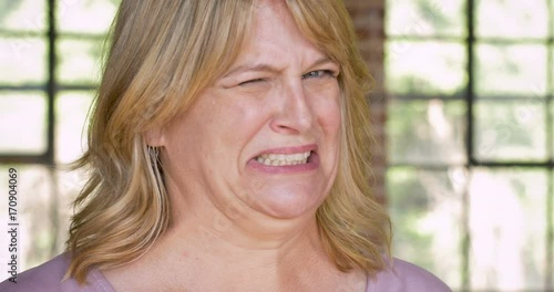 Woman grossed out disgusted and expressing yuck face