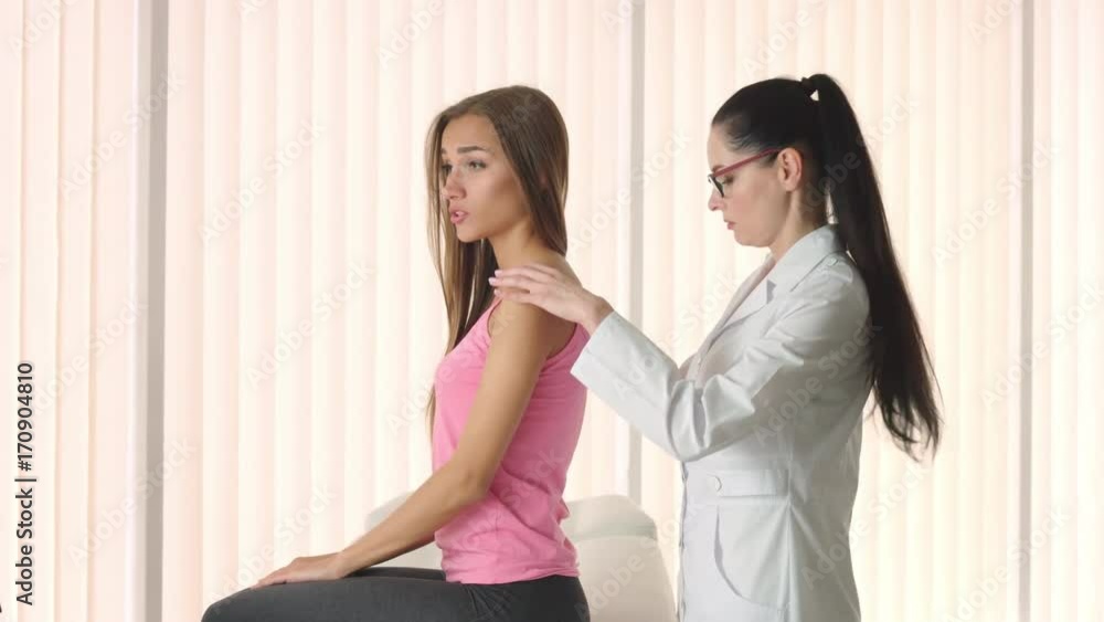 Neurologist check patient's back Neurologist check patient's back