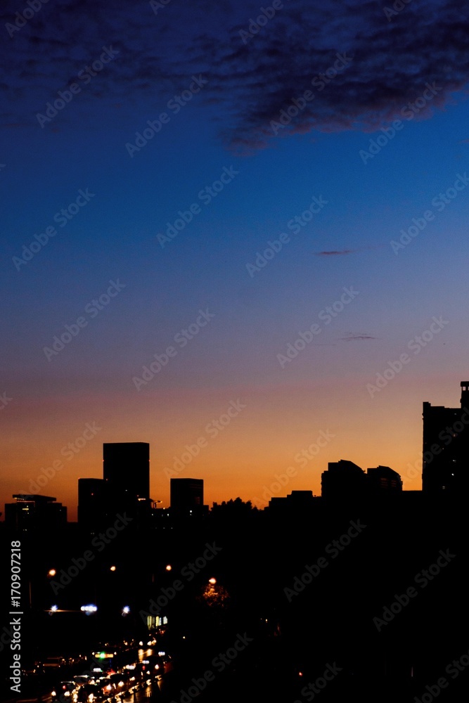 Skyline. Sunset sky silhouette and city.
