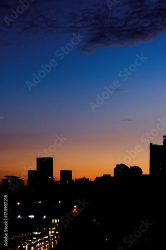 Skyline. Sunset sky silhouette and city.