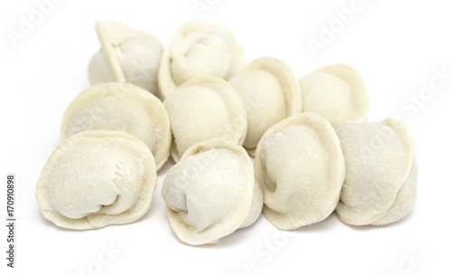 bunch of fresh frozen dumplings ready for cooking  isolated on white background