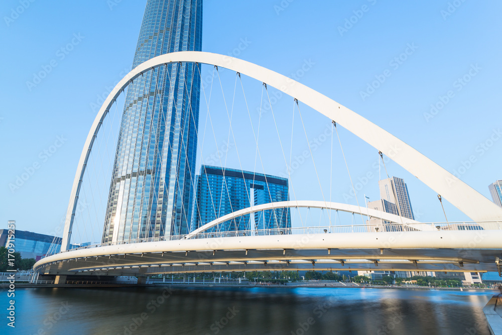 Obraz premium Tianjin Hai river waterfront downtown skyline with Dagu bridge,China.