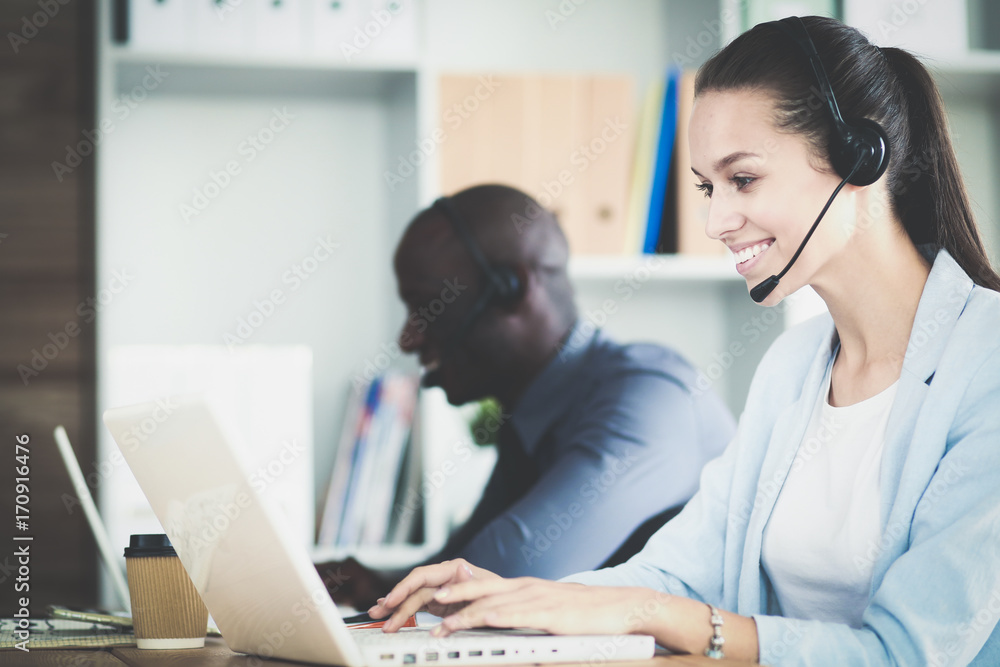Portrait of an African American young business man with headset. Portrait of an African American young business man with headset.