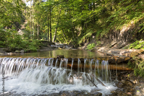   ascading waterfall of a mountain stream in the Carpathians
