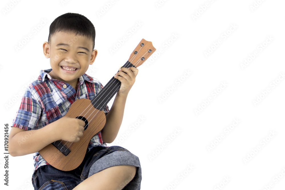 asian boy playing guitar on isolated white background asian boy playing guitar on isolated white background
