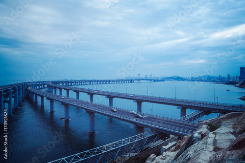 Dalian Cross-Sea Bridge against cloudy sky,China. © kalafoto
