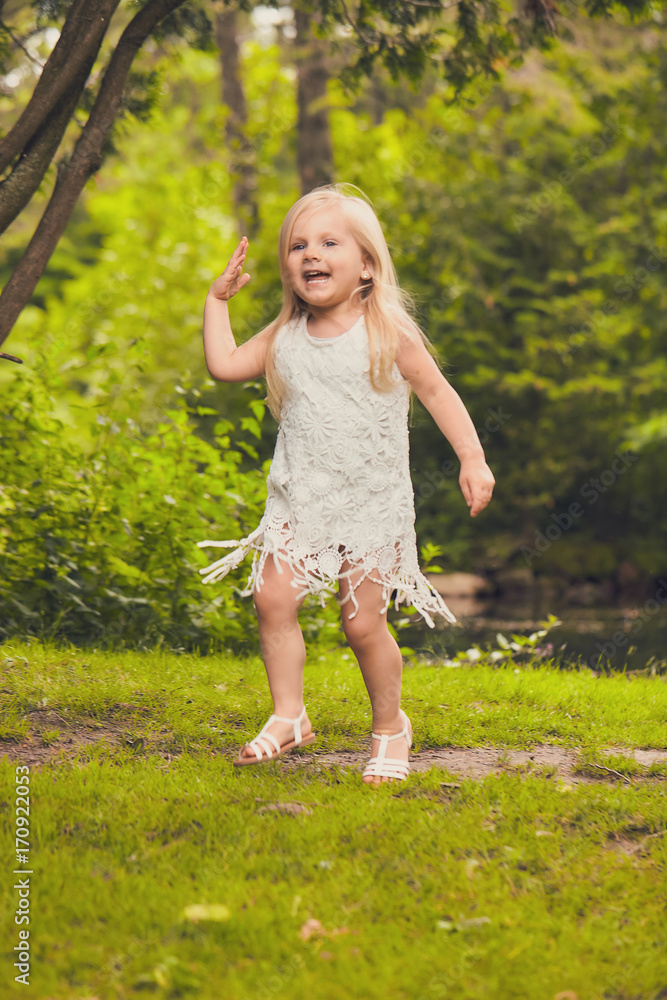 Portrait of happy little girl in summer forest Portrait of happy little girl in summer forest