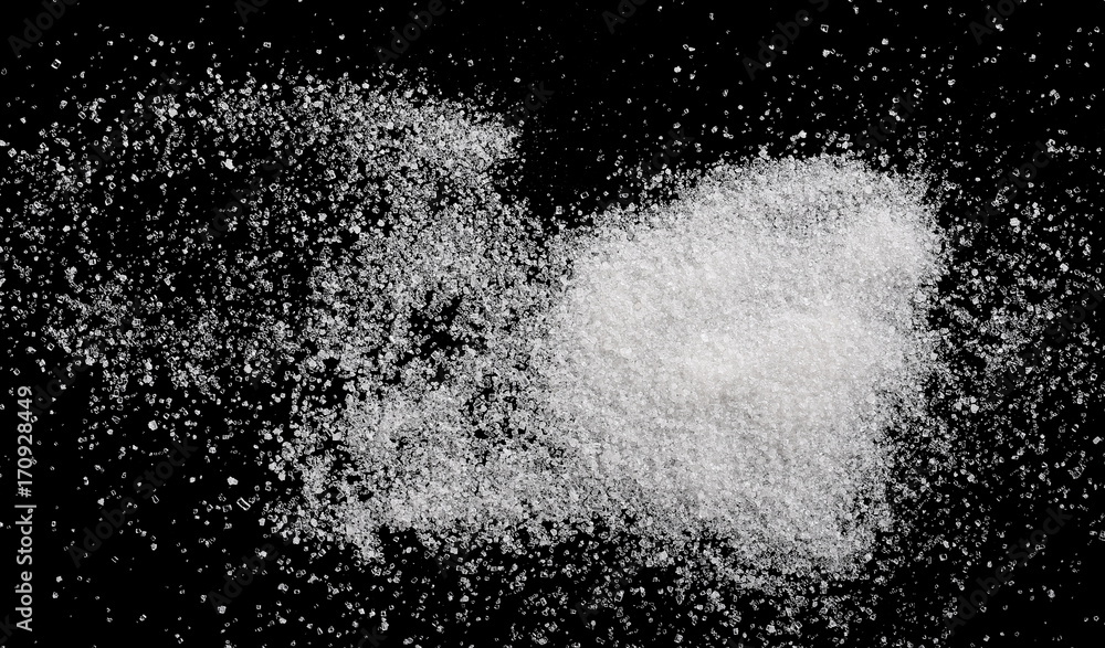 White crystal sugar pile isolated on black background and texture, top view