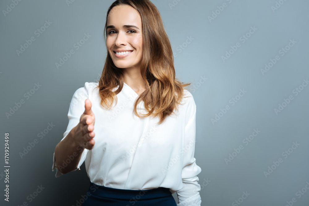 Cheerful attractive woman greeting you Cheerful attractive woman greeting you