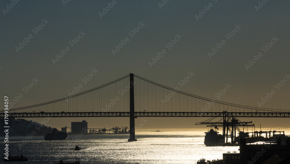 Fototapeta premium Tagus River Bridge in Sillouette