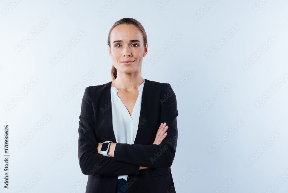 Pleasant confident woman standing cross armed Pleasant confident woman standing cross armed