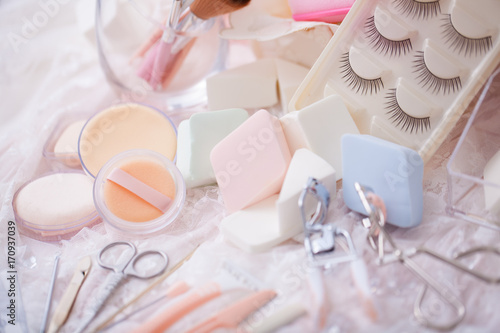 Cosmetic accessories mixed with hair salon equipment in cute candy color.