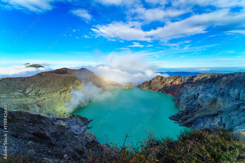 Beautiful Landscape mountain and green lake in the morning  at Kawah Ijen volcano , East Java, Indonesia