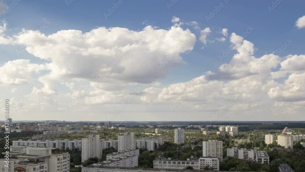 Clouds move over roofs of houses in the city, time-lapse 4K
Clouds move over roofs of houses in the city, time-lapse 4K