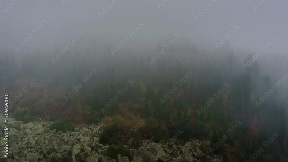 Fog and clouds over rocks and forest in the mountains in autumn. 4K time lapse.
Fog and clouds over rocks and forest in the mountains in autumn. 4K time lapse.