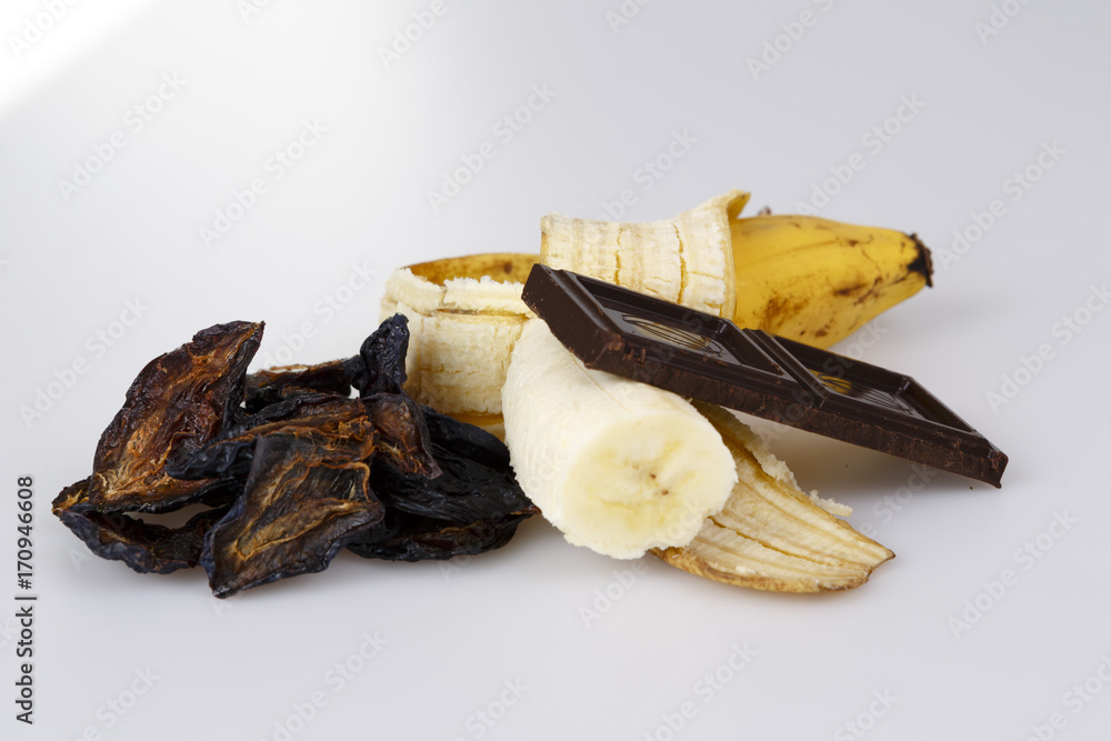 banana plum and chocolate on white