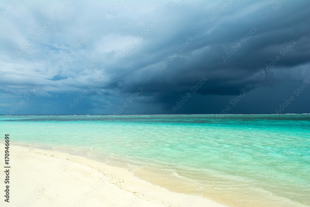 Cloudy landscape of Indian ocean sandy beach  before the storm