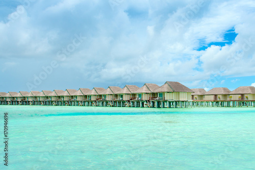 Fototapeta Naklejka Na Ścianę i Meble -  Wooden villas over water of the Indian Ocean, Maldives