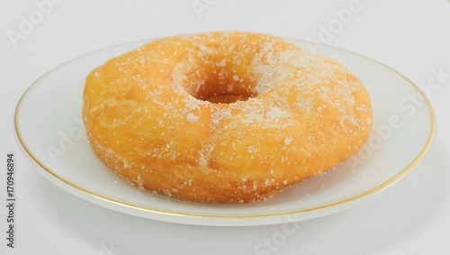 Glazed Donut with Sugar on White Dish