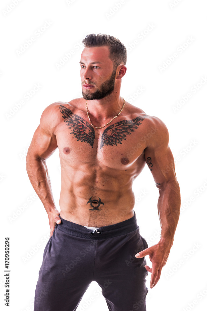 Handsome shirtless muscular man with jeans, standing, isolated on white background Handsome shirtless muscular man with jeans, standing, isolated on white background